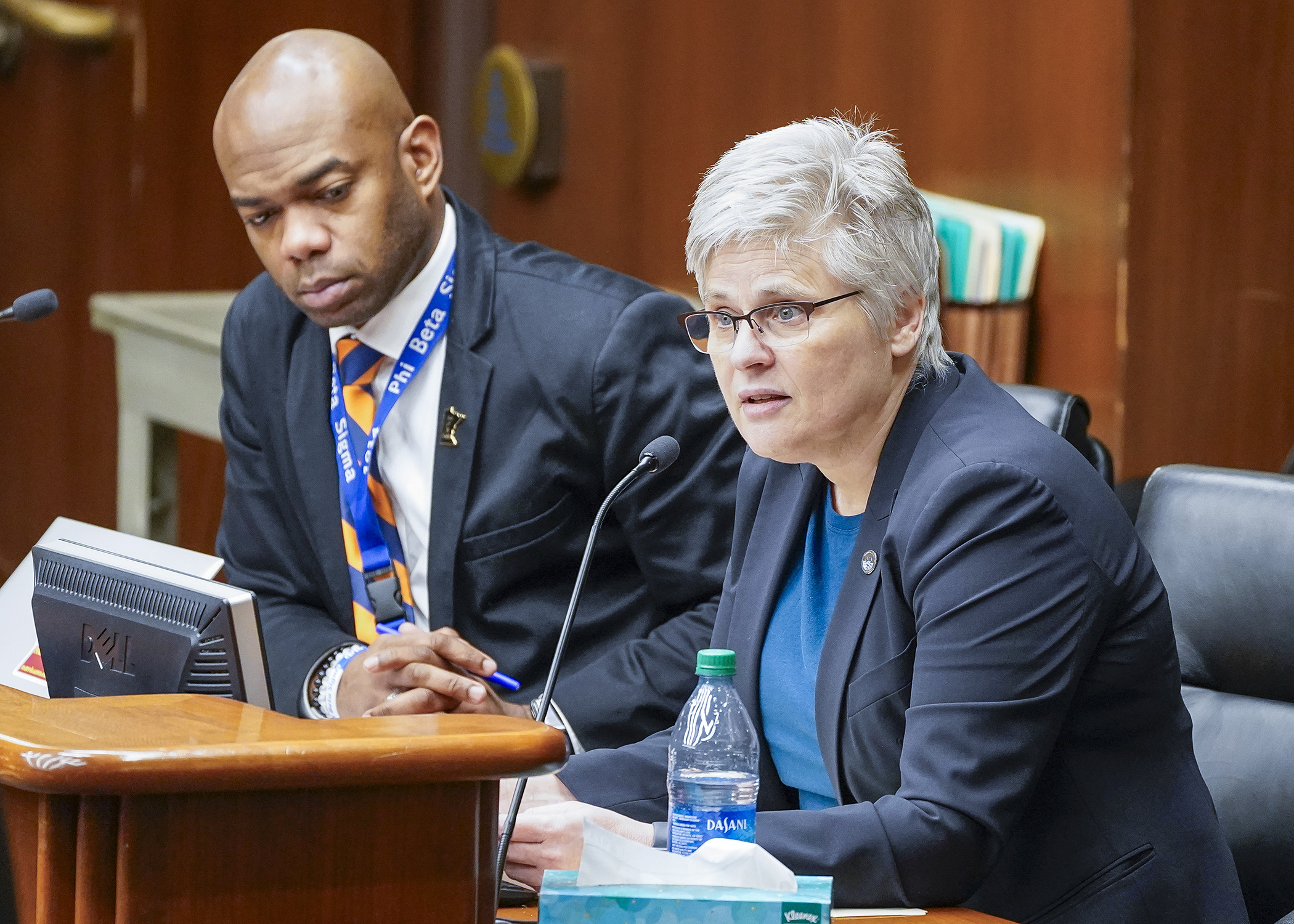 Hennepin County Attorney Mary Moriarty testifies in support of a bill sponsored by Rep. Cedrick Frazier, left, that would amend the standard for petition for postconviction relief based on newly discovered evidence. (Photo by Andrew VonBank)